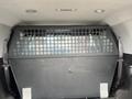 A 2016 Chevrolet Tahoe with a metal partition in the cargo area separating the passenger space from luggage space