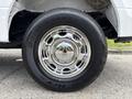 Close-up of a chrome wheel with a Bridgestone tire mounted on a 2018 Ford F-150