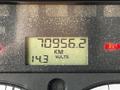 Dashboard display of a 2012 Freightliner M2 106 showing mileage of 70956.2 kilometers and a voltage reading of 14.3