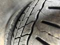 Close-up of a worn tire tread on a 2018 Chevrolet Express showing cracks and distinct grooves