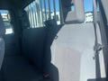 A 2014 Ford F-250 SD with gray fabric seating in the back row of the cab