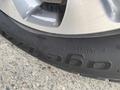 Close-up of a tire on a 2015 Kia Sorento showing the tread and brand name on the sidewall