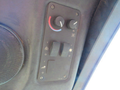 Control panel of a 2013 Toro Grounds Master 5910 featuring knobs and buttons for adjusting settings such as temperature and fan speed