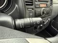 Close-up view of the control stalk for windshield wipers in a 2012 Nissan Versa showing various settings and symbols
