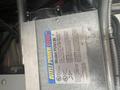 Inteli Power 9100 model PD0130 power converter with specifications and safety information displayed on a metal surface