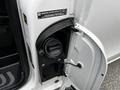 A close-up of the fuel filler cap of a 2020 Mercedes-Benz Metris with the cap open and a gas gauge visible inside