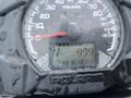 Dashboard of a 2017 Polaris Scrambler displaying speedometer and odometer readings with water droplets on the surface