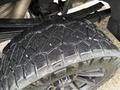 Close-up of a rugged tire on a 2022 GMC Sierra 3500HD showcasing deep treads designed for off-road traction