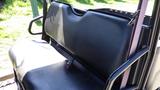 A black bench seat with a seatbelt designed for a 2016 Polaris Ranger 570 Crew utility vehicle