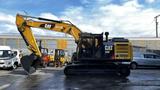 A 2018 Caterpillar 326F L Excavator with a yellow and black design features a large digging arm and bucket at the front