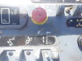 Control panel of a 2008 JLG Boom Lift featuring buttons and levers for operating the lift functions