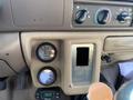 Dashboard of a 2000 Ford F-350 SD featuring gauges for fuel and temperature with empty panel where a stereo or accessory may have been installed