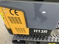 2024 AGT Industrial Yellow H13R Mini Excavator showing its side with labels and perforated ventilation areas