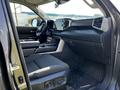Interior of a 2023 Toyota Tundra showcasing the driver's seat dashboard and center console with modern design elements and controls