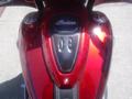 A top view of a 2017 Indian Chieftain Elite motorcycle showcasing its red glossy body and the Indian logo on the fuel tank