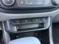 Close-up of the control panel in a 2018 GMC Canyon featuring buttons for hazard lights traction control and additional features