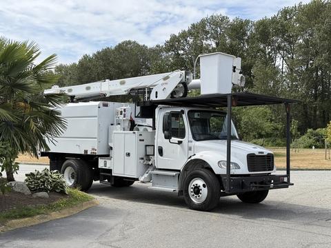 A 2020 Freightliner M2 utility truck equipped with a bucket lift and storage compartments on the side