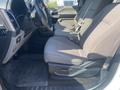 The interior of a 2017 Ford F-150 showing the front seats and dashboard with a steering wheel and controls visible