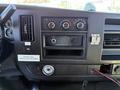 Dashboard of a 2013 Chevrolet Express featuring radio controls gauges and a microphone input