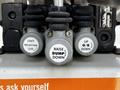 Control valves labeled with "Unit Selector," "Raise," "Dump," and "Down" on a 2012 Freightliner M2 106