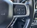 Close-up of the steering wheel controls in a 2022 RAM 3500 including buttons for cruise control and gear limit