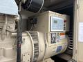 A 2005 Katolight SED60FPJ4 generator featuring a control panel with digital display and various warning labels alongside the engine and protective housing