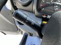 Steering column control stalk with settings for headlights and turn signals in a 2020 Hino 155