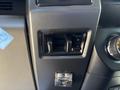 A close-up view of the control panel in a 2020 Ford F-350 SD featuring buttons for adjusting settings and an air conditioning dial