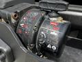 A WARN VR10 winch with visible labels and controls mounted in a vehicle interior