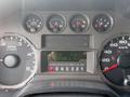 Dashboard of a 2008 Ford F-550 showing speedometer, tachometer, and various gauges with an odometer reading of 159930.3 km and a note about diesel fuel type