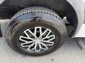 A close-up of a 2016 Mercedes-Benz Sprinter's front tire featuring a shiny alloy wheel with six spokes and a commercial tire brand inscription