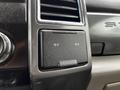 A close-up of the dashboard of a 2017 Ford F-550 showing a power outlet with two 12 V indicators