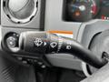 Close-up of the multifunction control stalk in a 2013 Ford F-650 used for controlling lights and wipers