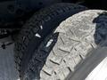 Close-up of a 2008 Ford F-450 SD tire showing tread pattern and texture