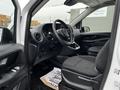 Interior of a 2019 Mercedes-Benz Metris featuring a driver's seat steering wheel and dashboard with controls and a modern design