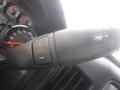 Close-up of the steering wheel controls in a 2015 Chevrolet Silverado 1500 featuring buttons for trailer adjustments and settings