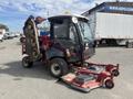A 2014 Toro Groundmaster 5910 turf maintenance vehicle with a cab and multiple mowing decks attached on the side and front