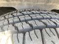 Close-up of a tire from a 2013 Ford Expedition showing deep tread patterns designed for traction and stability