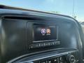 A central touchscreen display in a 2016 GMC Sierra 1500 showing options for audio and settings