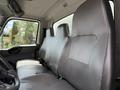 A 2022 International MV607 truck interior featuring two spacious grey seats designed for comfort and functionality