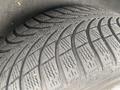 Close-up of a textured tire tread belonging to a 2009 BMW X5 showing detailed grooves and patterns designed for traction and performance