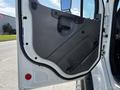 The image shows the open door of a 2012 Freightliner M2 112 truck featuring a gray interior panel and a door handle