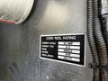A 2006 Emergency One Fire Truck is shown with a focus on a label detailing cord reel ratings including current rating voltage and cable length