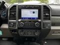 Dashboard of a 2020 Ford F-350 SD featuring a touchscreen display audio controls and climate control buttons