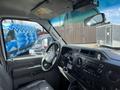 Interior view of a 2009 Ford Econoline with a steering wheel dashboard controls and driver seat visible