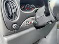 Interior dashboard of a 2008 Ford Econoline displaying speedometer and control buttons including a beacon switch