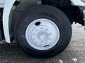 Close-up of the wheel and tire of a 2019 Hino 338 24 Foot Cube showing the silver rim and black tire tread