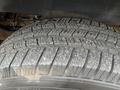 Close-up of a tire tread showing detailed patterns and textures on a 2012 Chevrolet Express tire