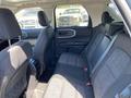 Interior view of the backseat of a 2023 Ford Bronco Sport featuring gray fabric upholstery and spacious seating with rear air vents