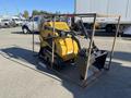 A yellow 2025 AGT INDUSTRIAL MX-MZT14 compact mini excavator with a front bucket and tracks, secured within a metal frame